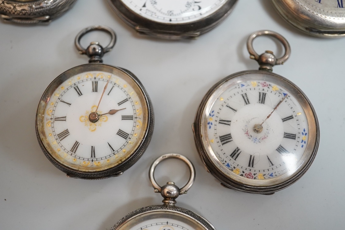 An early 20th century silver open faced pocket watch, with Arabic dial and subsidiary seconds, together with four other white metal open faced fob watches and a white metal half hunter pocket watch, case diameter 44mm.